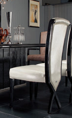 Two 43.5' White Leatherette and Black Wood Dining Chairs with X Shaped Rear Legs