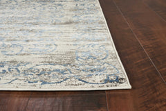 7'x10' Ivory Blue Machine Woven Distressed Floral Traditional Indoor Area Rug