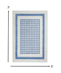 5’ x 7’ Ivory and Blue Geometric Area Rug