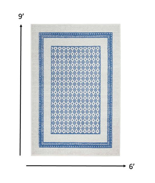 6’ x 9’ Ivory and Blue Geometric Area Rug
