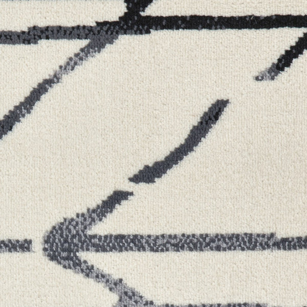 5' x 7' Cream and Black Distored Berber Area Rug